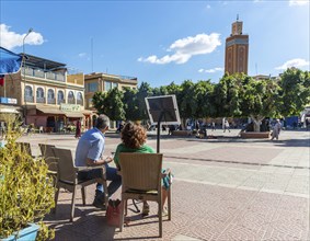 People sitting at cafe in main square, Place al Alouyane, Taroudant, Sous Valley, Morocco, north