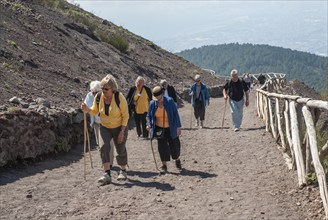 Tourists walking on a path to Vesuvius, near Naples, Parco Nazionale del Vesuvio, Campania, Italy,