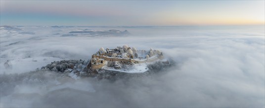 Aerial panorama of the Hegau volcano Hohentwiel with Germany's largest fortress ruins on a cold,