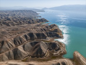 Barren landscape, aerial view, erosion landscape with canyons on the Naryn River, Toktogul