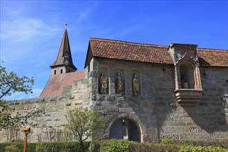 Entrance gate with Gothic wooden sculptures, St Sebastian, St George and St Laurentinus, fortified