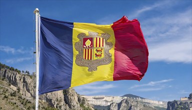 The flag of Andorra flutters in the wind