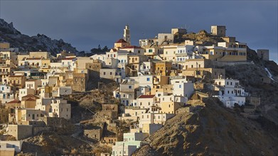 A view of an old mountain village whose houses glow in the sunlight, Colourful mountain village,