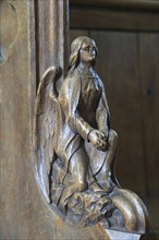 Carved wooden pew end figure, Huntingfield church, Suffolk, England, UK