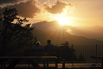 Couple watches the sunset on mountains, Sepino, Molise, Italy, Europe