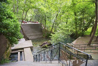 Nature trail with steps in the forest above a small river, spring, Tempe Valley, Tembi Valley,