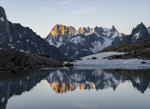 Morning atmosphere, mountain landscape at sunrise, reflection in Lac Blanc, mountain peak Grandes