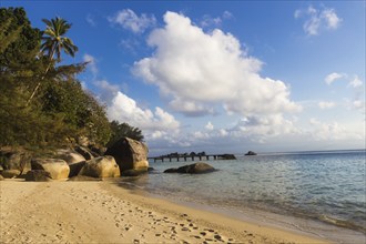 Sandy tropical beach with huge boulders. Malaysia