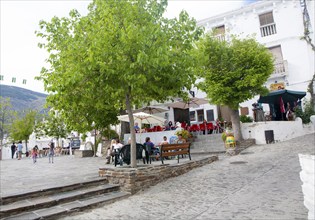 Cafes in square plaza village of Capileira, High Alpujarras, Sierra Nevada, Granada province,