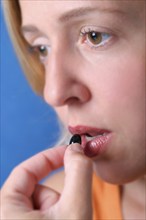 A young woman takes a painkiller, Studio