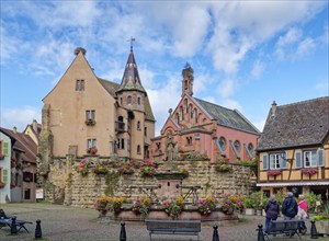 The St. Leon fountain on Saint-Leon Square in the centre of Eguisheim in Alsace. Well-kept