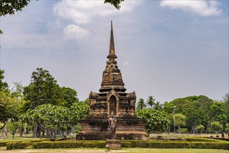 Buddha statue and chedi of the Buddhist temple Wat Sa Si, UNESCO World Heritage Sukhothai