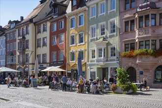 Street cafés in front of historic town houses in the old town centre of Villingen,