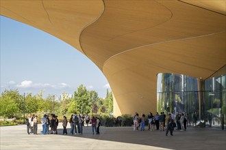 People in front of Oodi Central Library and Cultural Centre, design by ALA Architects, Helsinki,