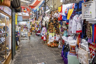 Alley in the market hall, stalls with colourful displays, Mercado Central de San José, San José,