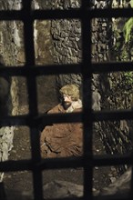 Prisoner inside the ruins of Urquhart Castle beside Loch Ness near Drumnadrochit, Scotland, UK