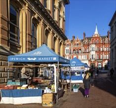 Street market stalls view to Lloyds Bank building, Princes Street, Ipswich, Suffolk, England, UK