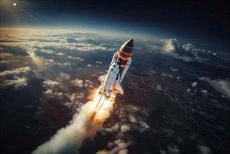 Aerial view of a rocket shuttle carrier launch at sunrise over an ocean coast. The rocket is