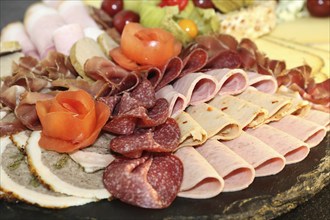 Party service: Cold platter with cheese, ham and grapes