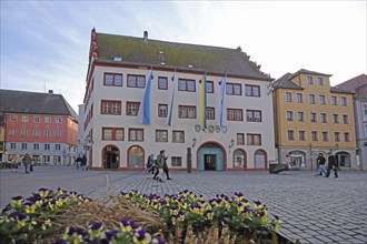 Town hall with flags built in 1531, city flag, Bavarian state flag, Ukrainian, Israeli, pedestrian,