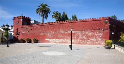 Moorish red castle walls in Plaza de la Constitucion, Alhama de Granada, Spain, Europe