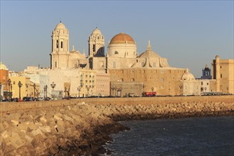 Cathedral church buildings viewed from the sea front, Cadiz, Spain, Europe