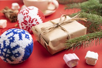 Christmas or New Year composition. Decorations, box, cinnamon, knitted balls, fir and spruce