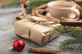 Christmas or New Year composition. Decorations, box, cinnamon, fir and spruce branches, cup of