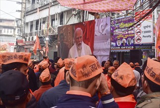 People watch live broadcast of the consecration ceremony of the Ram temple, in New Delhi, India on