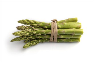 Bunch of fresh green asparagus isolated on white background. Side view, close up. harvest, healthy,