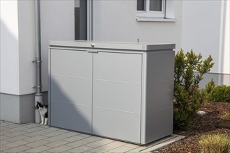 Plastic bin box in front of a residential building