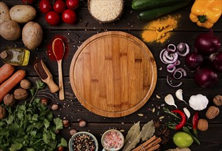 Assortment of ingredients and spices, for cooking, on a wooden background, concept, top view, food