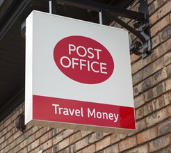 Close up Post Office travel money sign, Woodbridge, Suffolk, England, UK