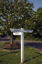 Road sign with direction pointers at road junction, Mistley, Essex, England, United Kingdom, Europe