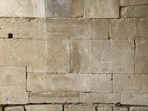 Detailed view of sandstone blocks Stones made of sandstone with written laws carved into the wall