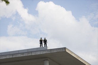 Two police officers observe the citizens' festival Celebrating democracy. / The Basic Law turns 75,