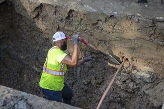 Detroit, Michigan, Workers replace old lead water service lines with copper pipes. Lead is harmful