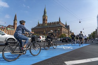 Cyclists on cycle paths, Radhuspladsen, City Hall Square, in the city centre of Copenhagen,