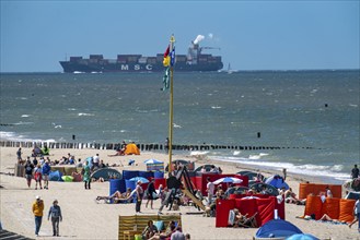 Beach of Domburg, in Zeeland, South Holland, Netherlands, in the background a container freighter