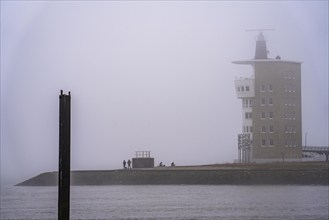 Thick fog in winter, hanging over the mouth of the Elbe into the North Sea, radar tower of the