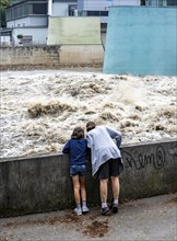 Weir of the Lake Baldeney in Essen, the masses of water roar through the open weirs, spectators,