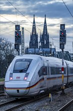 ICE train on the track in front of Cologne Central Station, Hohenzollern Bridge, Cologne Cathedral,