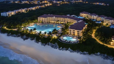 Aerial view of real estate beach resort at the Caribbean coast at night, AI generated