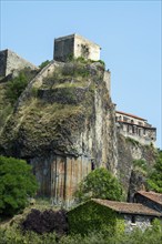 Stunning basalt organs rise above the village of Chilhac in Haute-Loire, Auvergne-Rhône-Alpes,