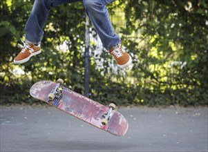 A person does a kickflip on a skateboard in Berlin, 16/08/2024