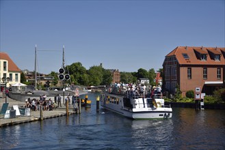 Europe, Germany, Mecklenburg-Western Pomerania, island town of Malchow, Lake Malchow, at the swing