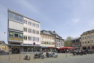 Market place with motorbikes and street pub, houses, Kirn, Hunsrück, Rhineland-Palatinate, Germany,