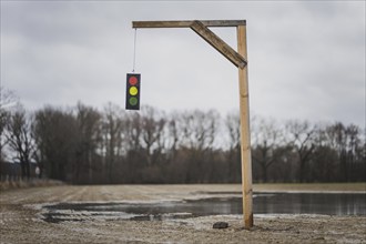 A gallows with a symbolic traffic light stands in a field near Gablenz, 14 Jan. 2024. As part of