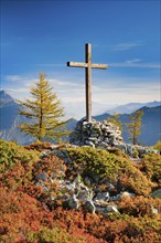 View of the Valais mountains and the Rhone valley with summit cross in autumn, Lower Valais,