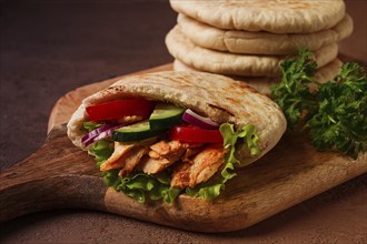 Shawarma in pita bread, chicken, with vegetables, homemade, no people